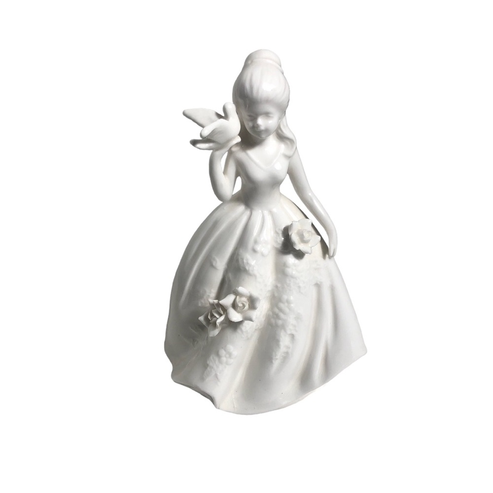 Andrea By Sadek 8” porcelain woman with bird figurine